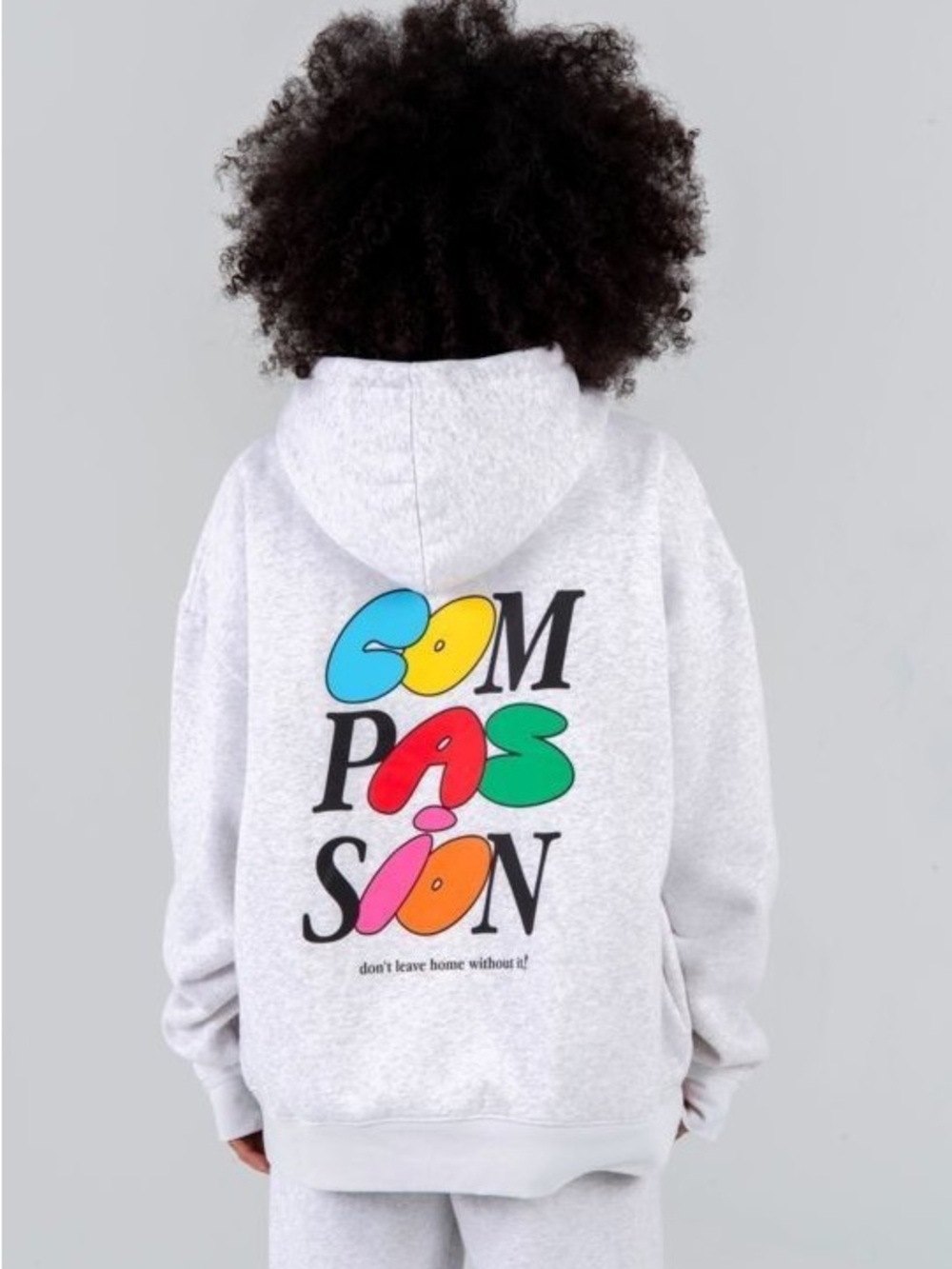 Mayfair Group “Compassion don’t leave home without it” hoodie unisex one size